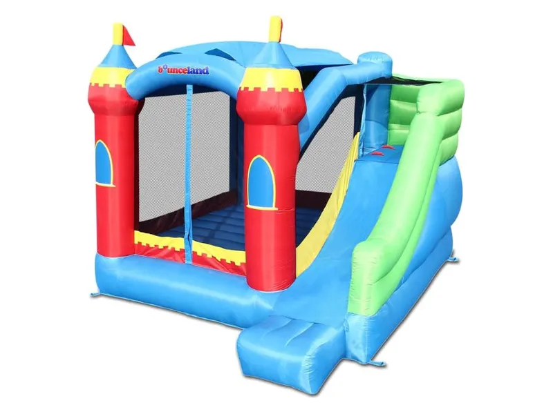 Bounceland Royal Palace castle bounce house with a long green and blue slide