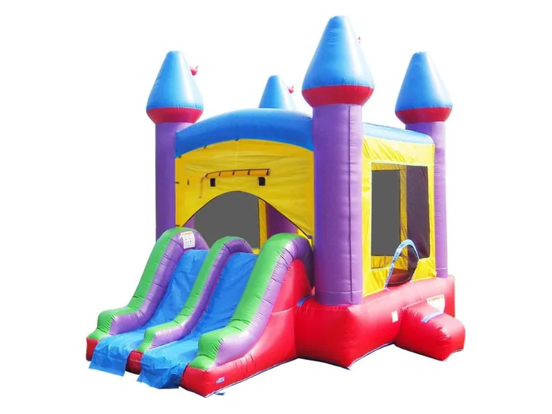 HeroKiddo castle bounce house with purple towers, blue cone roofs and a two-lane slide striped green, blue and red