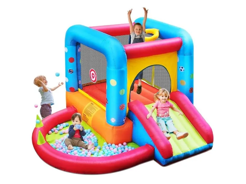 Step4Fun castle bouncer with a slide, a ring of pit balls and children playing on it